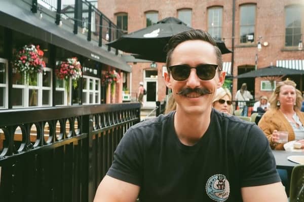 Sam, the owner of Mural City Web Design, at an outdoor cafe in Philadelphia